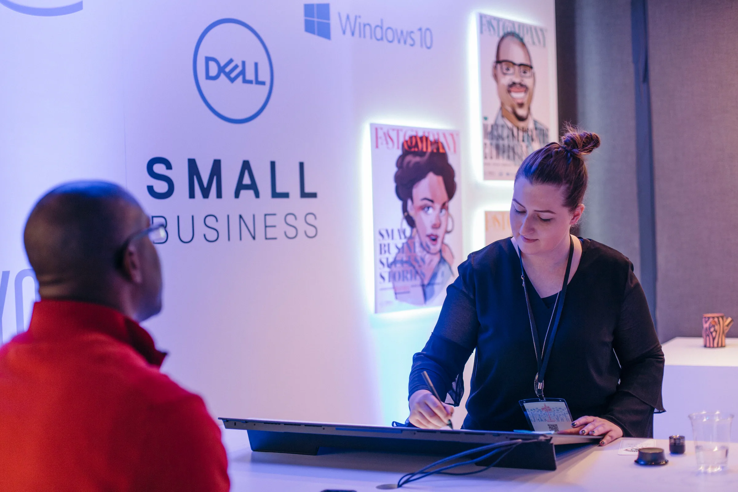 A Dell Small Business activation with illustrated portrait panels