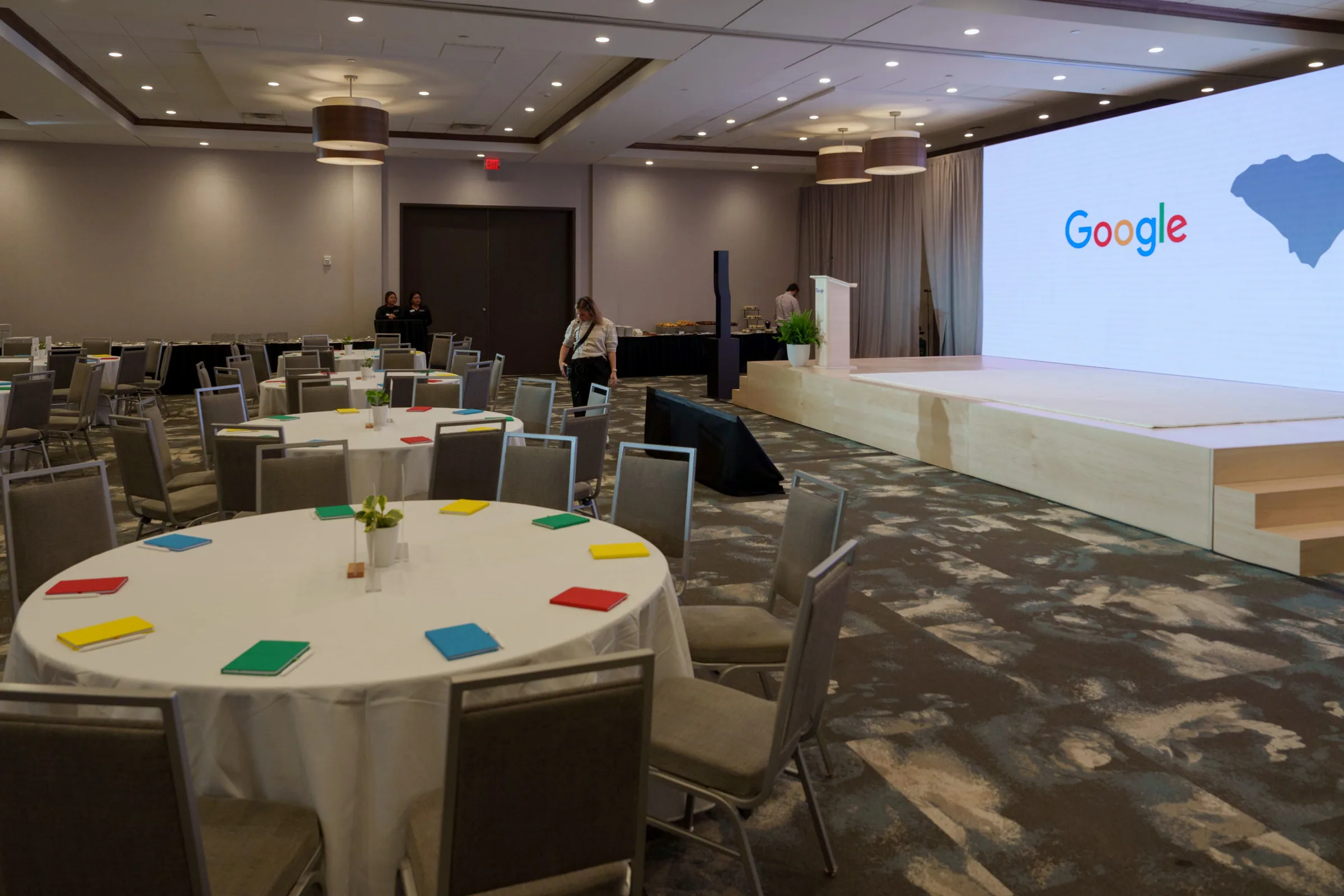 The ballroom set with rounds and the stage